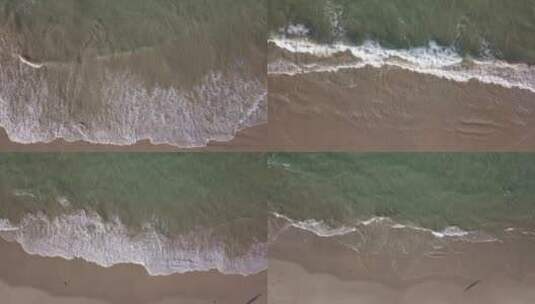 垂直排石海浪涌上沙滩唯美海岸线风景高清在线视频素材下载