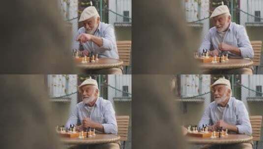 退休老人围着桌子下国际象棋 高清在线视频素材下载
