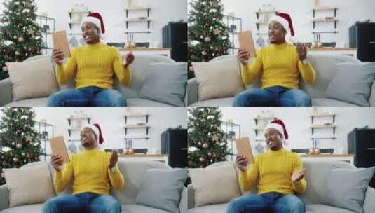 圣诞节男人使用平板和家人视频高清在线视频素材下载