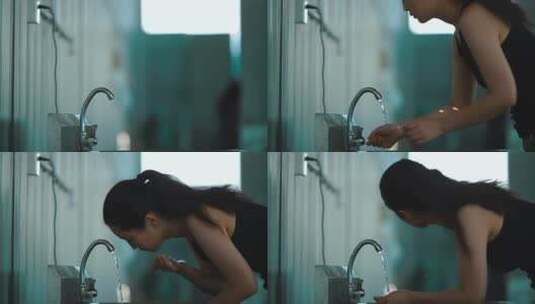 女子在水龙头下洗脸洗漱高清在线视频素材下载