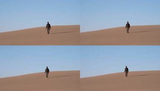 走在沙丘上的人高清在线视频素材下载