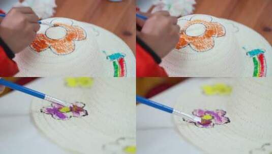小朋友在帽子上画画做手绘高清在线视频素材下载