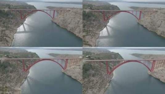 克罗地亚马斯莱尼察桥。乔治的红色钢桥。马斯莱尼察海峡的景色。无人机射击高清在线视频素材下载