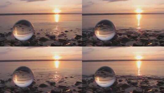 日落时海边的透明玻璃球高清在线视频素材下载