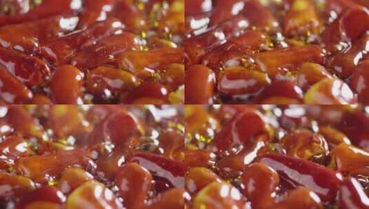 2K高速摄影沸腾的油中煮着辣椒摇移高清在线视频素材下载