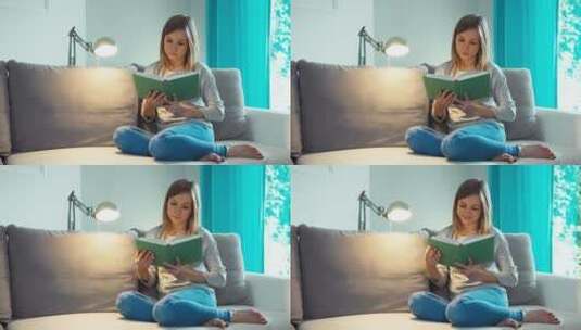 美丽的年轻女人在客厅看书 高清在线视频素材下载