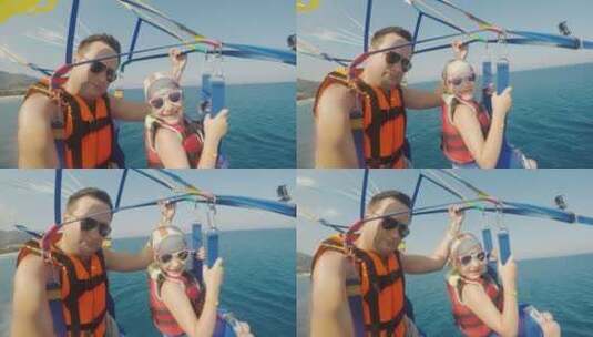 爸爸和女儿在玩滑翔伞 高清在线视频素材下载
