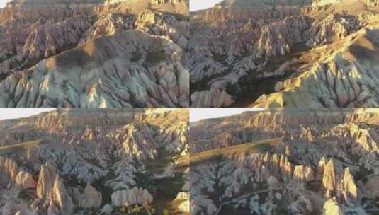 卡帕多西亚土耳其日落中的头罩、仙女烟囱和沉积火山岩高清在线视频素材下载