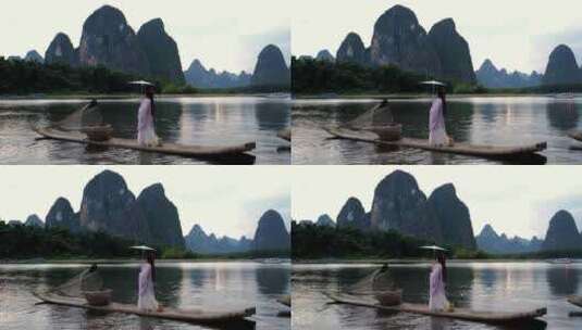 桂林山水漓江竹筏上的古风汉服美女背影高清在线视频素材下载