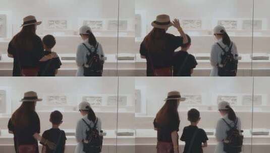 家长带着孩子在博物馆参观文物高清在线视频素材下载