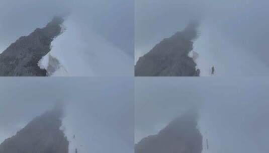 航拍攀登川西横断山脉乌库楚雪山的登山者高清在线视频素材下载