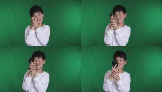 帅气的中国小男孩使用智能手机打电话慢镜高清在线视频素材下载