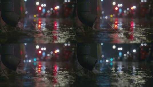 雨中从排水管中倾泻在城市的街道高清在线视频素材下载