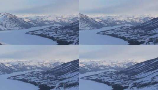 航拍新疆冬季喀纳斯河流晨雾雪山森林雪景高清在线视频素材下载