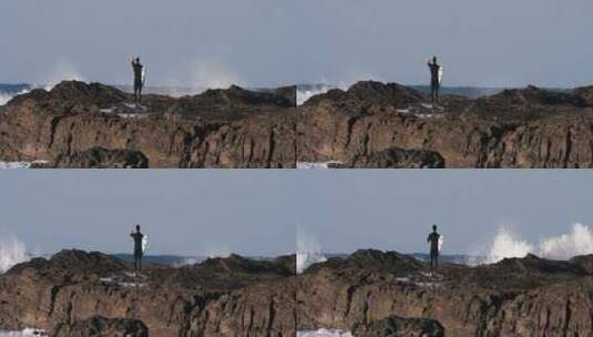 站在岩石上的冲浪者高清在线视频素材下载
