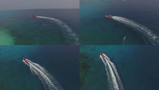在碧海中快速穿行的红船高清在线视频素材下载