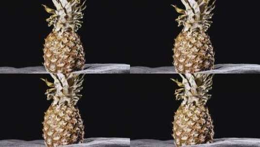 菠萝在黑色背景上旋转高清在线视频素材下载