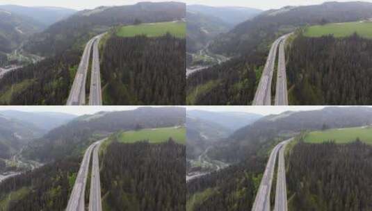 从空中俯瞰山区的高速公路高清在线视频素材下载
