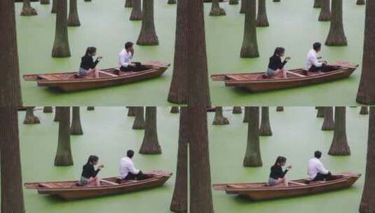 小舟上坐着的男女《水上森林》网红打卡地高清在线视频素材下载