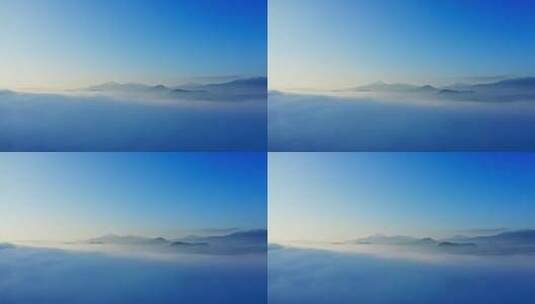 清晨蓝天下云雾缭绕的腾冲火山群高清在线视频素材下载