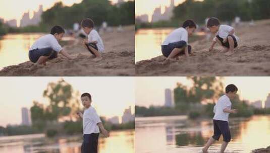 小男孩在河边的沙滩上挖沙子堆城堡高清在线视频素材下载