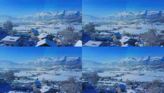 瑞士阿尔卑斯山的镜头，蓝天和地上的房子高清在线视频素材下载