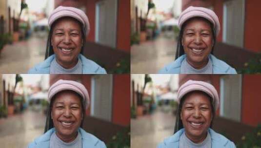 户外摄像机上微笑的资深非洲妇女高清在线视频素材下载