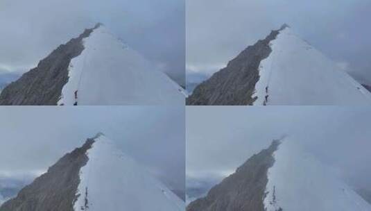 航拍攀登川西横断山脉乌库楚雪山的登山者高清在线视频素材下载