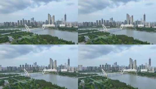 南京眼步行桥，奥体双子塔的航拍风光高清在线视频素材下载