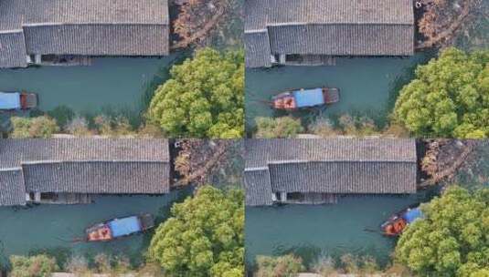 航拍江苏周庄古镇的水乡的乌篷船高清在线视频素材下载