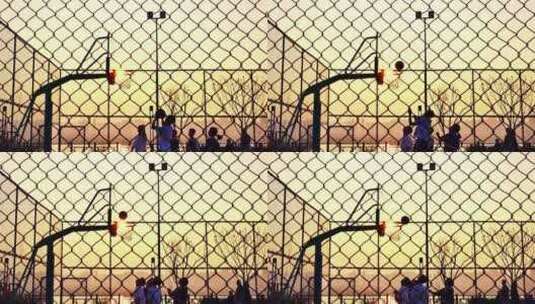 夕阳下球场打篮球升格镜头高清在线视频素材下载