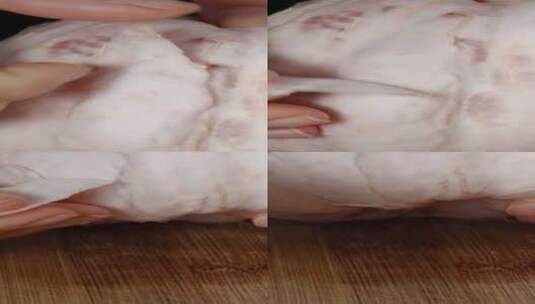 垂直视频。女性手剥柚子肉厚皮的特写镜头。高清在线视频素材下载