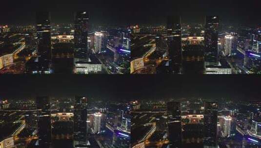 河南郑州绿地双子塔地标建筑夜景航拍高清在线视频素材下载