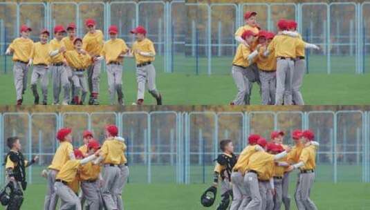学校里的棒球一队穿着黄色制服的男孩棒球运动员得到拥抱和欢庆高清在线视频素材下载