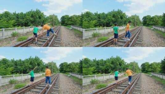 小孩走在铁路上玩耍高清在线视频素材下载
