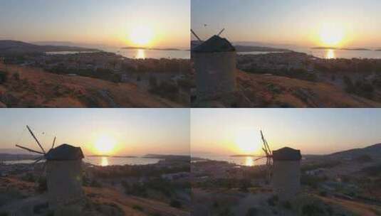日落时海边古老的传统历史石头风车高清在线视频素材下载