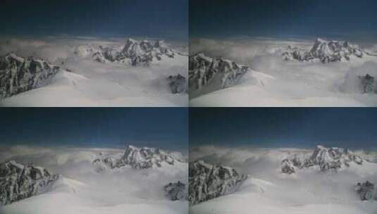 雪山上翻滚的云朵高清在线视频素材下载