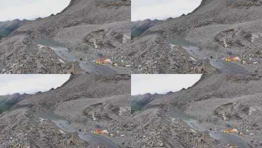 航拍攀登贡嘎山卫峰乌库楚雪山的登山者营地高清在线视频素材下载