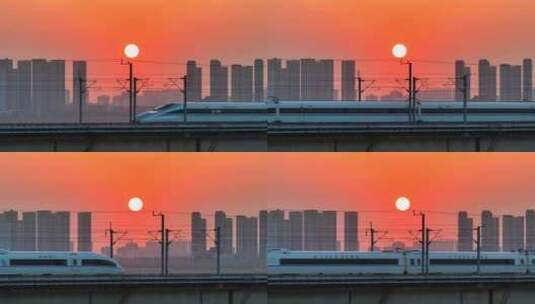 中国高铁和谐号复兴号动车黄昏日落穿过城市高清在线视频素材下载