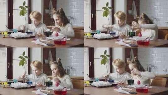 男孩和女孩用勺子在彩色液体里浸泡高清在线视频素材下载