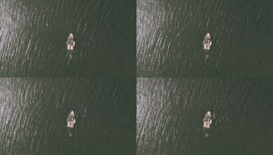 航拍快艇在海面上救助冲浪者高清在线视频素材下载