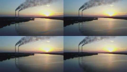 日落时沿河而建的化工厂高清在线视频素材下载