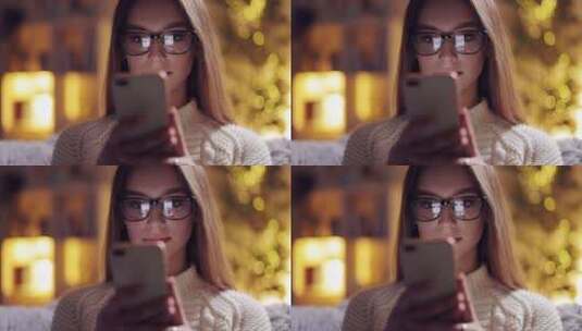 女人带着眼镜在玩手机高清在线视频素材下载