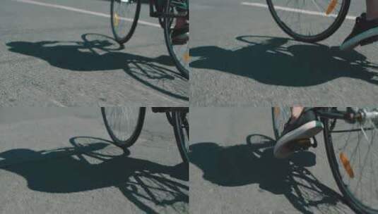 一个城市骑自行车的人和他在路上的影子高清在线视频素材下载