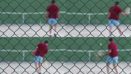 在墙上弹球的网球运动员高清在线视频素材下载