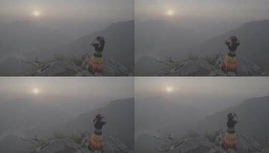 少数民族少女在山崖上喊山呼唤太阳升起02高清在线视频素材下载