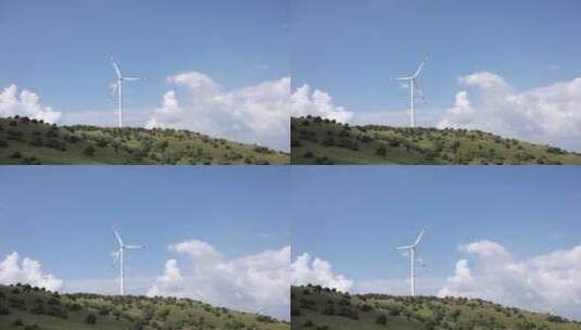 晴天山坡上的风力发电机高清在线视频素材下载