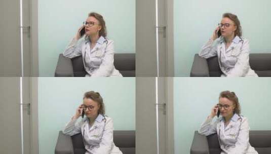 女医生在诊所打电话高清在线视频素材下载