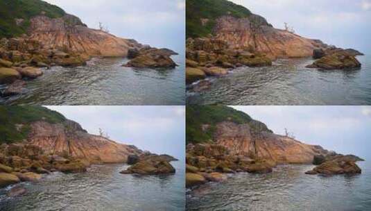 海南三亚早晨海岛海边海浪拍打礁石高清在线视频素材下载