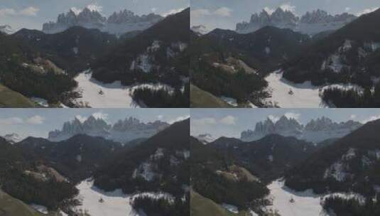 意大利南蒂罗尔圣约翰教堂和雪山的鸟瞰图。高清在线视频素材下载